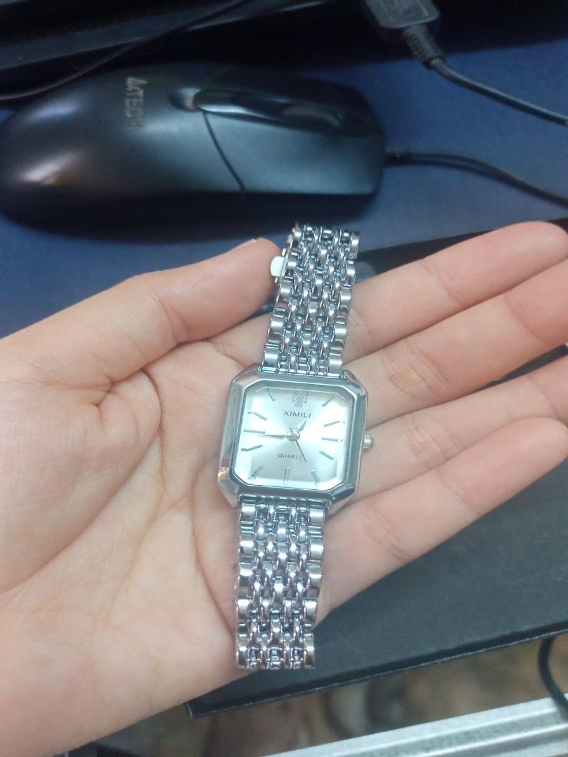 XIMIVOGUE Quartz Watch (Category: Women's Watches) located in Manila. Submitted by perro.cl (Listing ID 1432435775, Image 3). Description: - XIMILI quartz watch - Silver rectangular dial - Stainless steel bracelet - Includes original box - Comes with an extra battery - Adjustment tool included - Classic design - Suitable for everyday wear - only worn once and super good as new RFS - I have new watch.