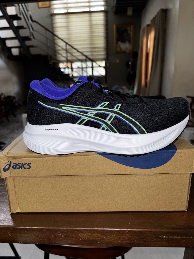 Asics Gel-Excite 11 Running Shoes (Category: Sneakers) located in Manila. Submitted by armerchandise (Listing ID 1432628539, Image 1). Description: - BRANDNEW AUTHENTIC with receipt 1011C080-004 Black Vital Green 42 EU 8.5 Us mens Asics Gel-Excite 11 running shoes - Color: Black with blue and green accents - Size: US 8.5 / EUR 42 / CM 26.5 - Features Amplifoam+ technology - Includes original box - Made in Indonesia - White sole with black tread.
