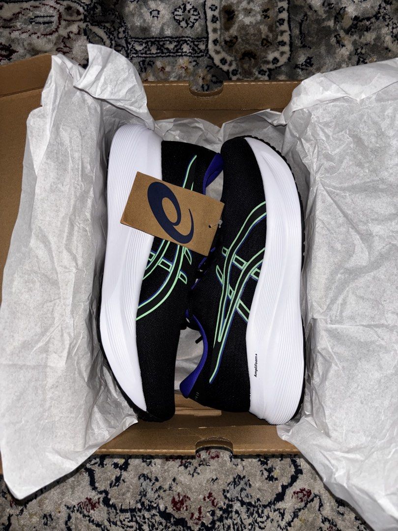 Asics Gel-Excite 11 Running Shoes (Category: Sneakers) located in Manila. Submitted by armerchandise (Listing ID 1432628539, Image 2). Description: - BRANDNEW AUTHENTIC with receipt 1011C080-004 Black Vital Green 42 EU 8.5 Us mens Asics Gel-Excite 11 running shoes - Color: Black with blue and green accents - Size: US 8.5 / EUR 42 / CM 26.5 - Features Amplifoam+ technology - Includes original box - Made in Indonesia - White sole with black tread.