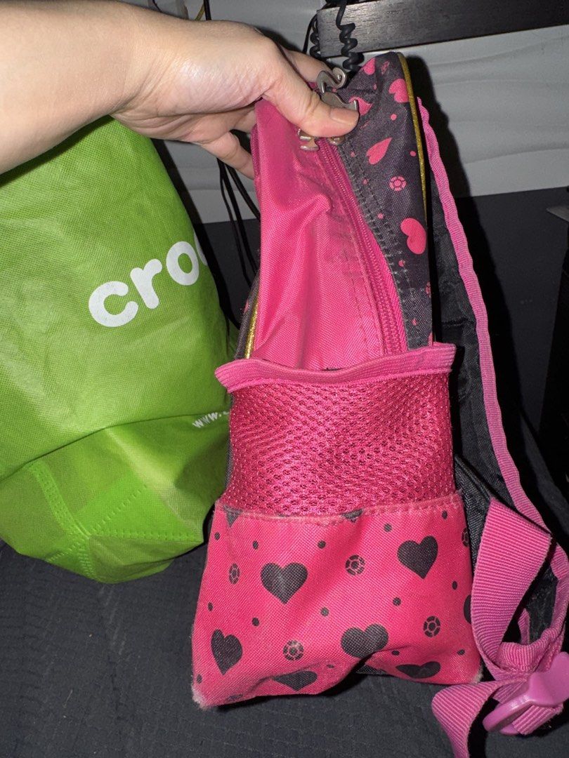 Barbie Pink Backpack (Category: Backpacks) located in Paranaque City. Submitted by ledzai (Listing ID 1432628319, Image 2). Description: - Pink Barbie backpack age 3 to 7yrs old - Features a large Barbie graphic - Includes "Shine so Bright" text - Two side pockets - Adjustable straps - Barbie-print interior lining - Dimensions: Approximately 15 inches (H) x 12 inches (W) .