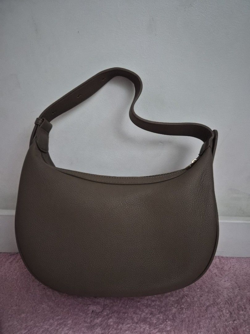Bostanten Shoulder Bag (Category: Luxury Bags & Wallets) located in Manila. Submitted by aya_gurl (Listing ID 1432765764, Image 2). Description: - Brand: Wandler - Color: Neutral Brown - Design: Curved - Strap: Single shoulder strap - Closure: Zipper - Material: Textured.