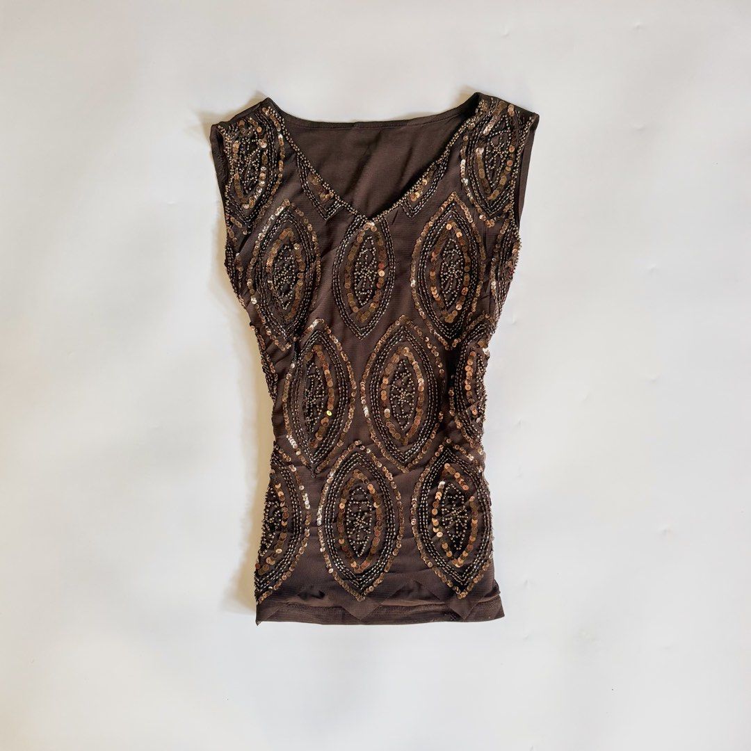Brown Beaded Sleeveless Top (Category: Sleeveless) located in Iloilo. Submitted by notriaaa (Listing ID 1432764009, Image 1). Description: - Brown sleeveless top - Intricate bead and sequin detailing - Most Favorite Heavy Beaded Top ✨ -Size: fits Large -Bust: 38 -W: 32-33 Discoloration in some beads, see last photo ₱750.
