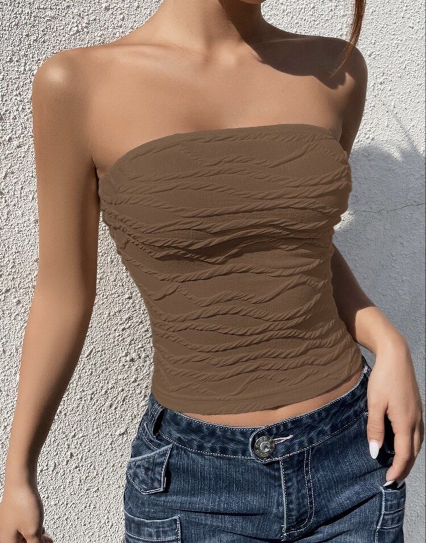 Brown Textured Tube Top (Category: Sleeveless) located in Makati City. Submitted by misisellis (Listing ID 1432682110, Image 2). Description: - Brown textured tube top - Strapless design - Cropped length - Stretchy, body-hugging material - Great for casual wear - Pairs well with high-waisted bottoms.