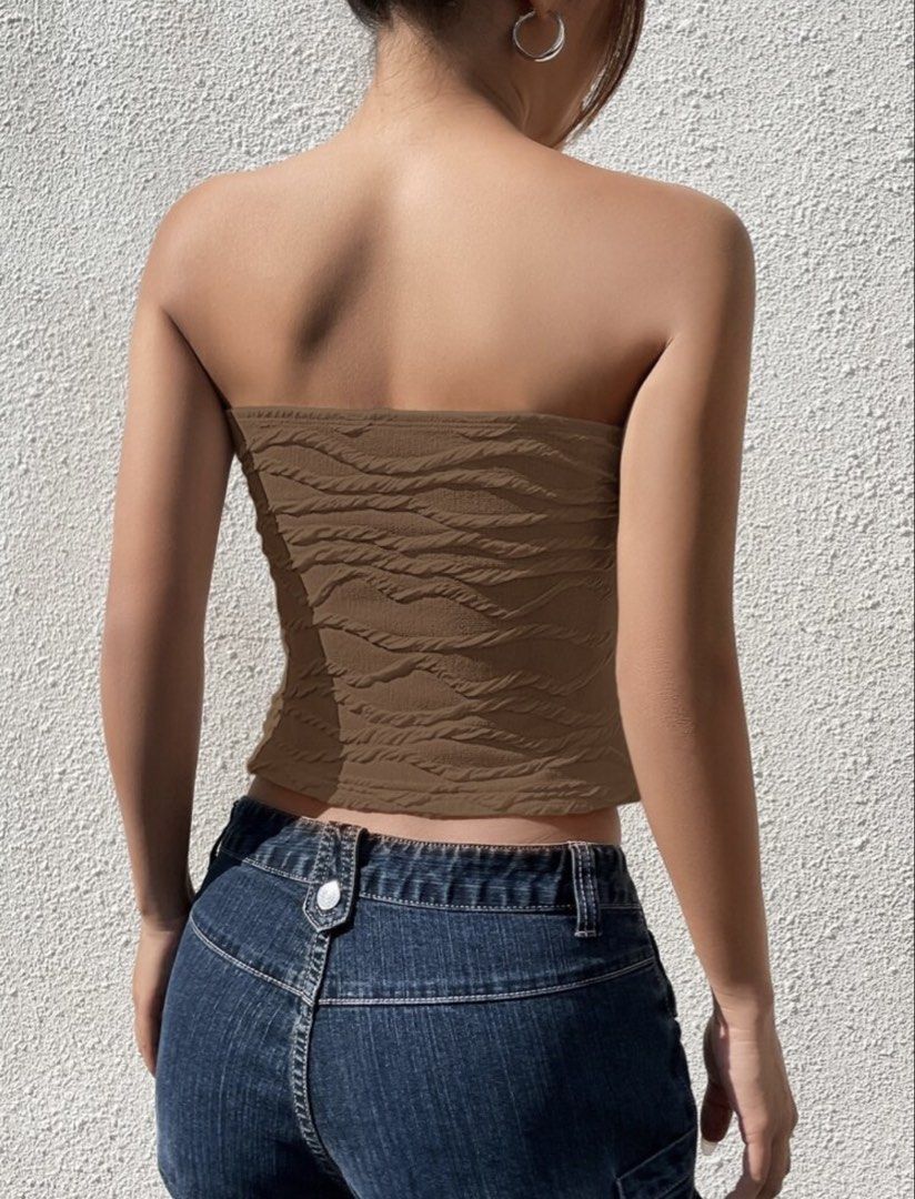 Brown Textured Tube Top (Category: Sleeveless) located in Makati City. Submitted by misisellis (Listing ID 1432682110, Image 3). Description: - Brown textured tube top - Strapless design - Cropped length - Stretchy, body-hugging material - Great for casual wear - Pairs well with high-waisted bottoms.