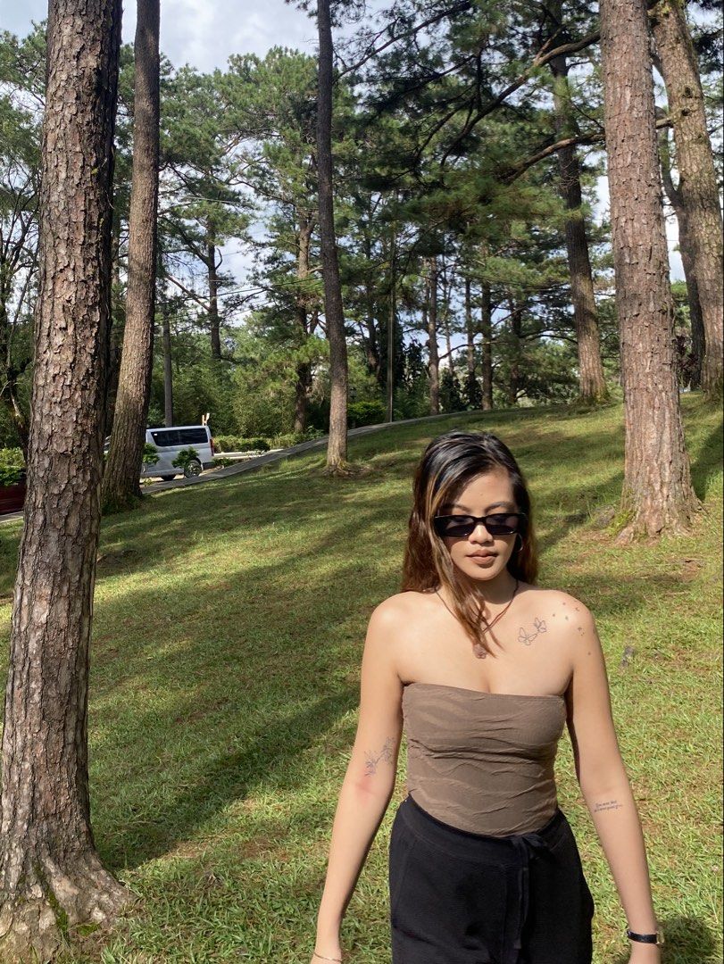 Brown Textured Tube Top (Category: Sleeveless) located in Makati City. Submitted by misisellis (Listing ID 1432682110, Image 1). Description: - Brown textured tube top - Strapless design - Cropped length - Stretchy, body-hugging material - Great for casual wear - Pairs well with high-waisted bottoms.