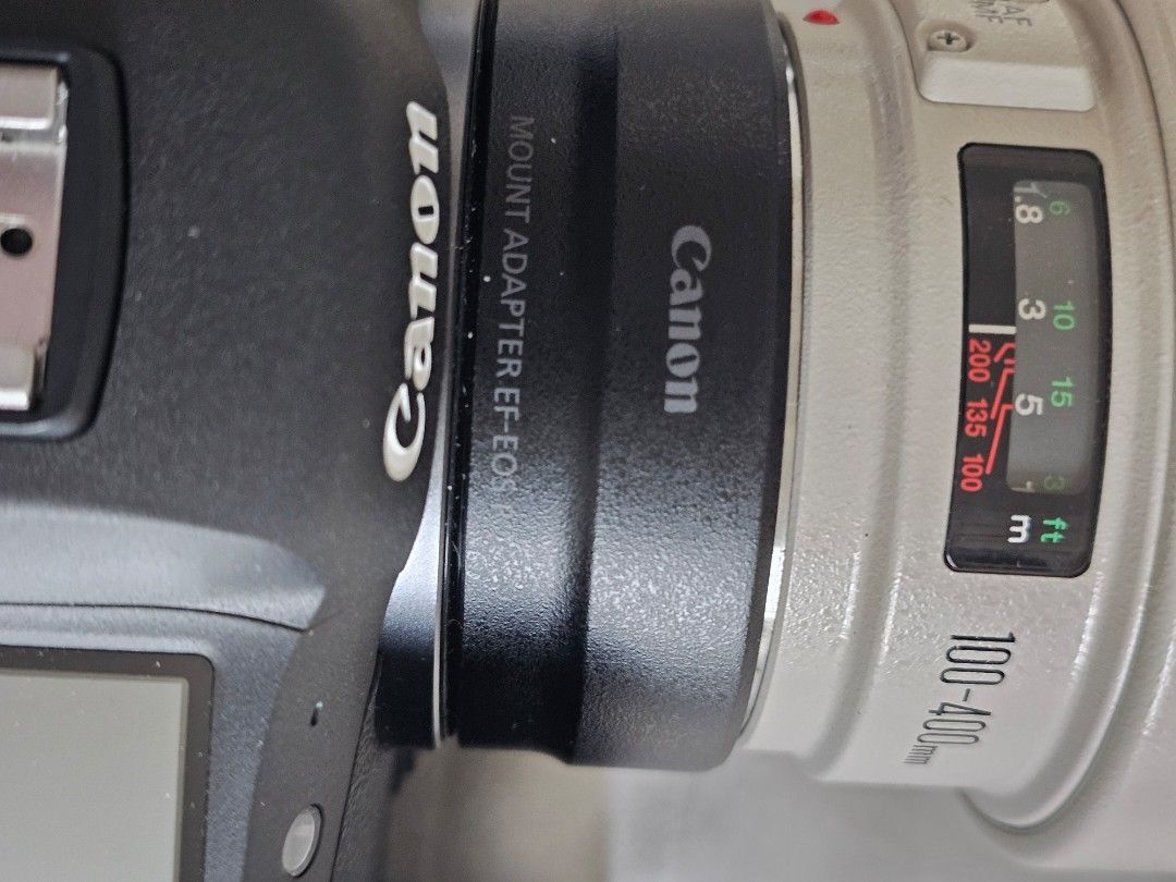 Canon EF 100-400mm Lens with EOS Mount Adapter (Category: Cameras) located in Tagbilaran City. Submitted by lugarpogi (Listing ID 1432625922, Image 2). Description: - Canon EF 100-400mm lens - Includes Canon EOS mount adapter - Compatible with Canon EOS camera bodies - Zoom range: 100-400mm - Lens finish: White and black - Lens hood included. with Body Canon R5.