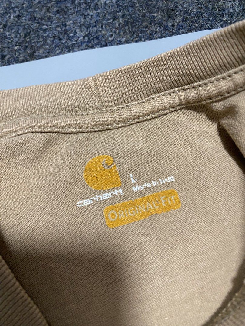 Carhartt Original Fit Pocket Tee - L (Category: Tshirts & Polo Shirts ) located in Manila. Submitted by owabaet12 (Listing ID 1432710043, Image 2). Description: - Carhartt Original Fit Pocket Tee - Size: L - Color: Neutral - Features chest pocket with Carhartt logo - Material: 100% Cotton - Style: K87 - Made in Haiti.