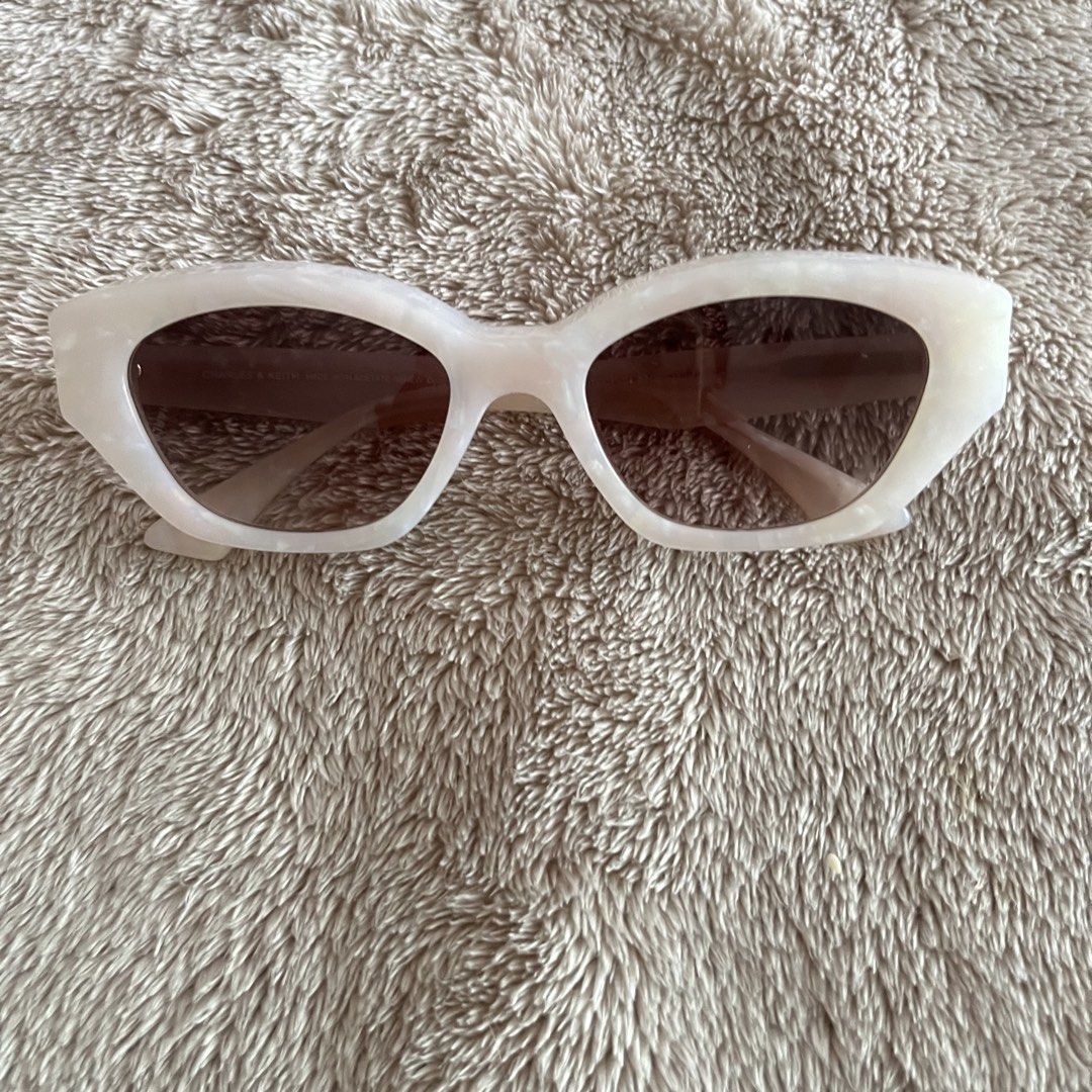 Charles & Keith Onyx Cat-Eye Sunglasses (Category: Sunglasses & Eyewear) located in San Juan City. Submitted by _ands_ (Listing ID 1432758665, Image 1). Description: - Color: Pearl - Bnew; never used (no tags) - No flaws .