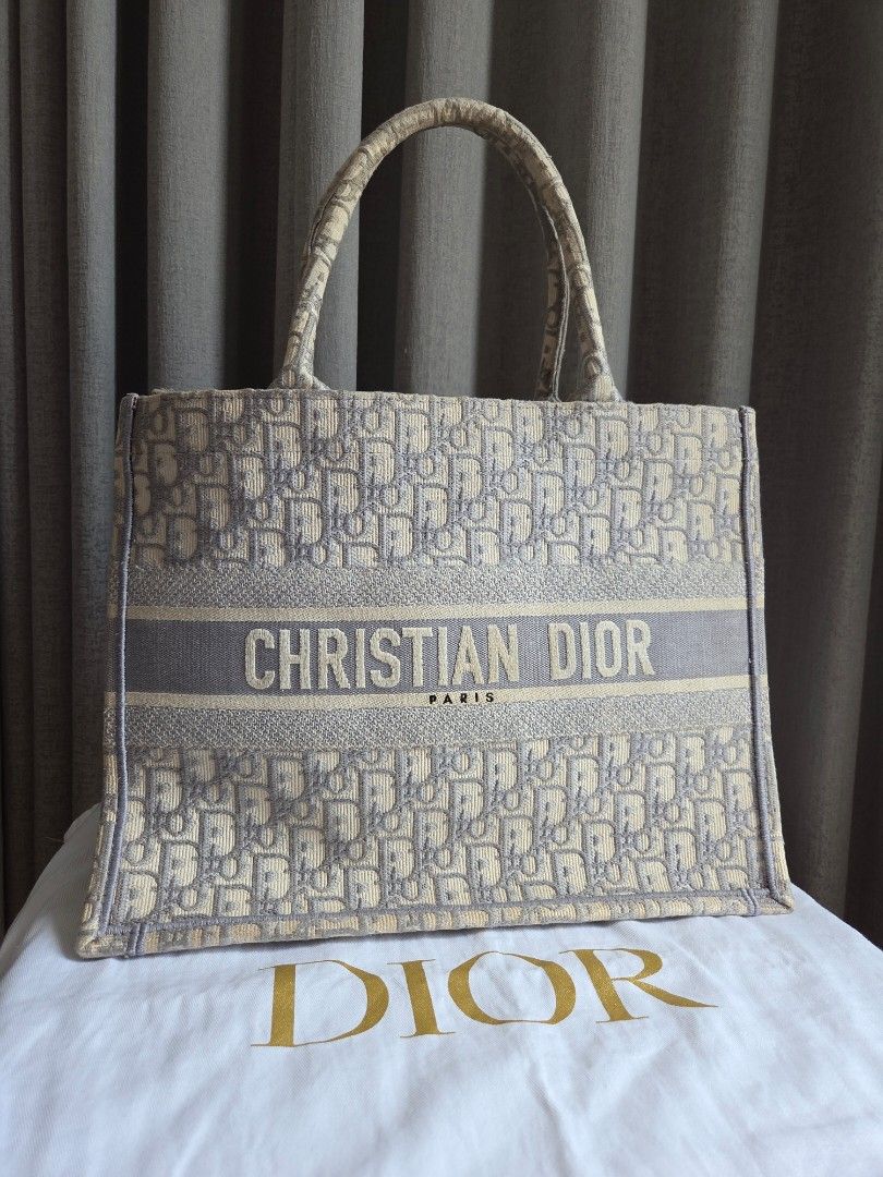 Christian Dior Booktote (Category: Luxury Bags & Wallets) located in Quezon City. Submitted by shop.mar.go (Listing ID 1432621022, Image 1). Description: comes with dust bag and paper bag only price is slightly negotiable, kindly make an offer if your sure with ur price..
