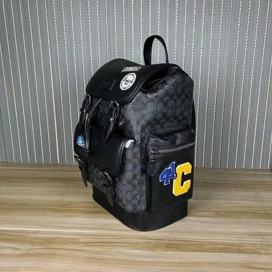 Coach Men's Sprint Backpack (Category: Luxury Bags & Wallets) located in Rizal. Submitted by vanbdc24 (Listing ID 1432716324, Image 3). Description: - Stylish Coach backpack in black. - Features the iconic Coach pattern. - Multiple compartments: front pocket, side pockets, and zippered interior pocket. - Adjustable shoulder straps and top handle. - Includes Coach patches and a 4C patch. - Drawstring closure. - Comes with a Coach hang tag..