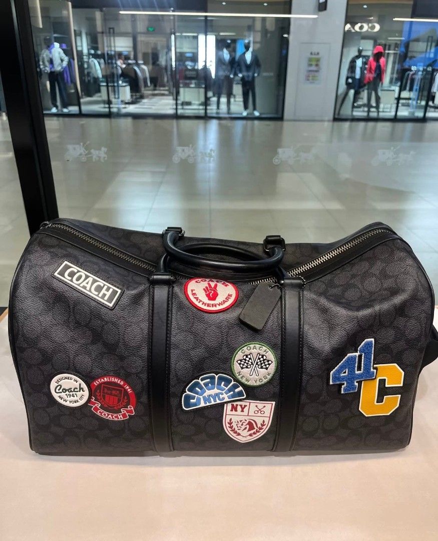 Coach Venturer Duffle Bag (Category: Luxury Bags & Wallets) located in Rizal. Submitted by vanbdc24 (Listing ID 1432706739, Image 2). Description: - Coach duffle bag - Signature monogram pattern - Features various patches - Top handle - Zip closure - Available in different sizes and colors - Classic design - Includes a detachable tag - Ideal for travel or everyday use.