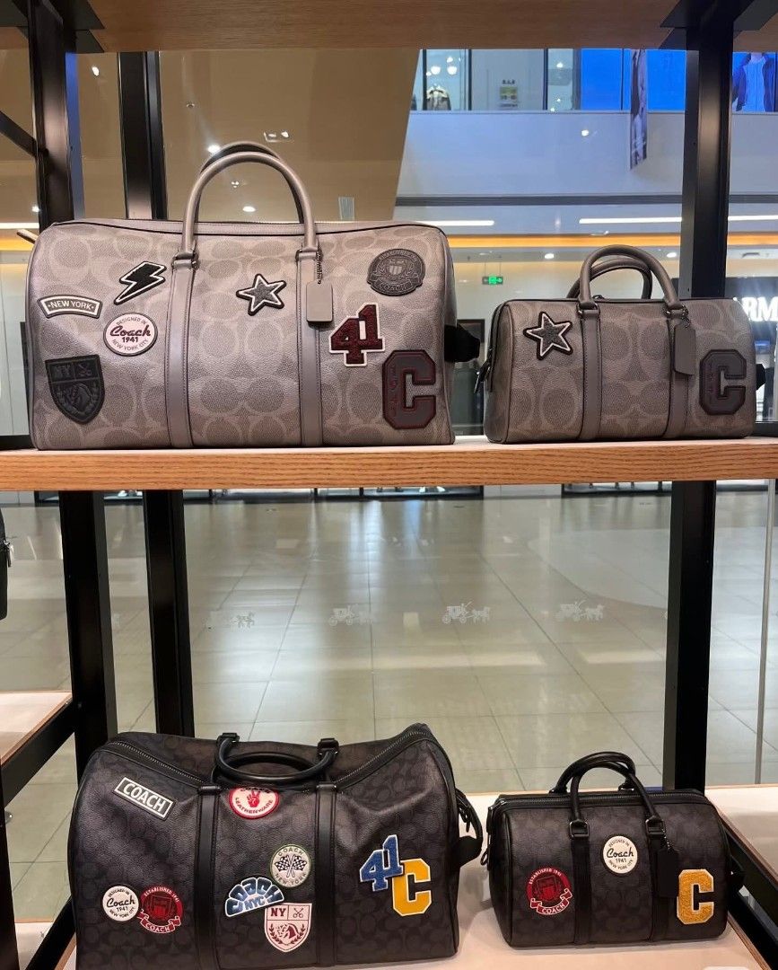 Coach Venturer Duffle Bag (Category: Luxury Bags & Wallets) located in Rizal. Submitted by vanbdc24 (Listing ID 1432706739, Image 1). Description: - Coach duffle bag - Signature monogram pattern - Features various patches - Top handle - Zip closure - Available in different sizes and colors - Classic design - Includes a detachable tag - Ideal for travel or everyday use.