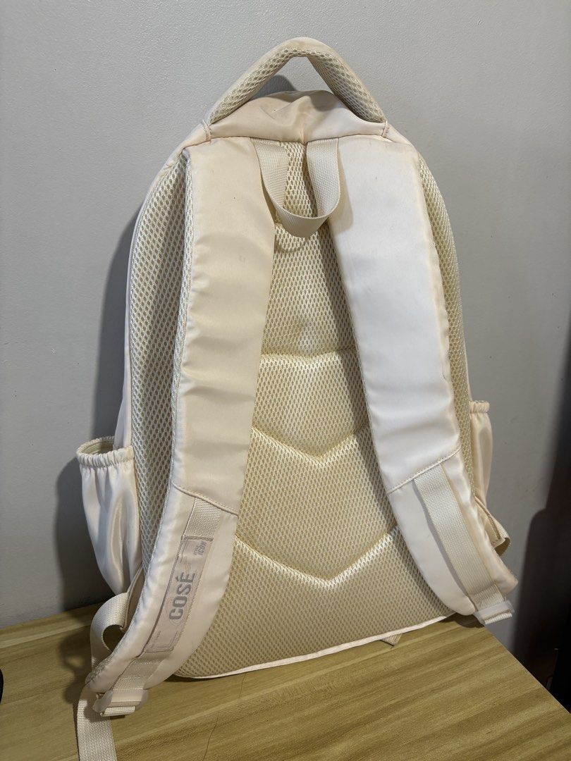 COSE Backpack (Category: Backpacks) located in Pasig City. Submitted by petite_declutter (Listing ID 1410359382, Image 3). Description: - Cream white backpack with a cute pattern - Brand: COSE - Features a front zipper pocket - Includes side pockets - Adjustable straps for comfort - Perfect for school or everyday use.