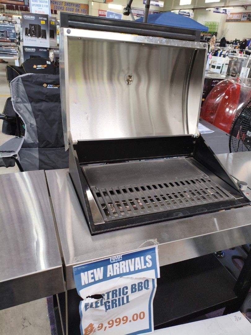 Crossray Infrared Electric BBQ Grill (Category: BBQ, Grills & Hotpots) located in Manila. Submitted by hmrgrace5. (Listing ID 1432616910, Image 3). Description: - Stainless steel electric BBQ grill - Built-in thermometer - Includes grilling surface and warming rack - Mounted on a stainless steel table - Features a lower shelf for storage - Equipped with wheels for easy movement - Price: ₱9,999.00.