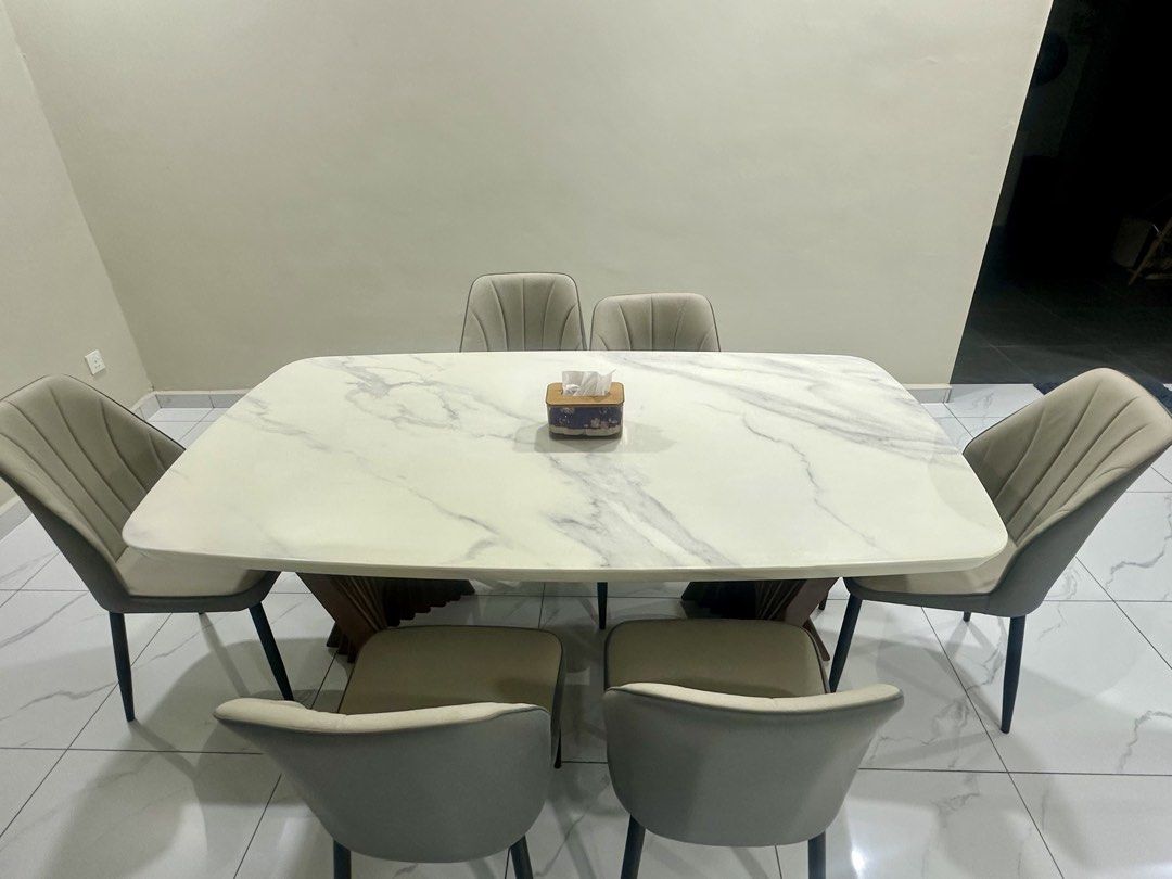 Dining Table (Category: Tables & Sets) located in Johor Bahru. Submitted by seenu0508 (Listing ID 1432694196, Image 1). Description: 🚨 URGENT CLEARANCE SALE! First come, first served. Must arrange own transport and collection. 📩 Interested? PM me now! Serious buyers only. Price negotiable for a quick deal! Solid marble dining table set with 6 cushioned chairs. Elegant modern design with strong base and durable top. Chairs are comfortable and st