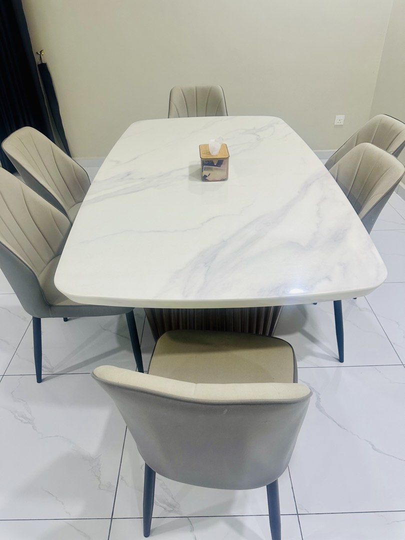 Dining Table (Category: Tables & Sets) located in Johor Bahru. Submitted by seenu0508 (Listing ID 1432694196, Image 2). Description: 🚨 URGENT CLEARANCE SALE! First come, first served. Must arrange own transport and collection. 📩 Interested? PM me now! Serious buyers only. Price negotiable for a quick deal! Solid marble dining table set with 6 cushioned chairs. Elegant modern design with strong base and durable top. Chairs are comfortable and st