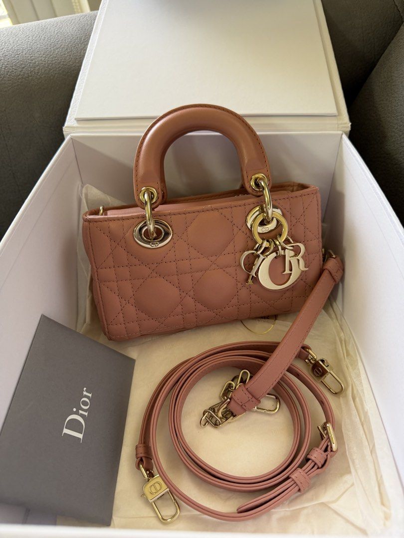 Dior D-Joy Micro Bag (Category: Luxury Bags & Wallets) located in Manila. Submitted by az.purse (Listing ID 1432751963, Image 1). Description: - Authentic Lady Dior Micro Bag - Beautiful blush color - Includes original box and dust bag - Features a top handle and detachable shoulder strap - Iconic Dior charms and quilted pattern - Gold-toned hardware -2022 purchased.