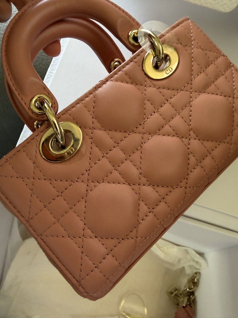 Dior D-Joy Micro Bag (Category: Luxury Bags & Wallets) located in Manila. Submitted by az.purse (Listing ID 1432751963, Image 3). Description: - Authentic Lady Dior Micro Bag - Beautiful blush color - Includes original box and dust bag - Features a top handle and detachable shoulder strap - Iconic Dior charms and quilted pattern - Gold-toned hardware -2022 purchased.