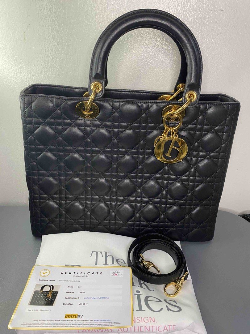 Dior Lady Dior Black Leather Handbag (Category: Luxury Bags & Wallets) located in Quezon City. Submitted by pinkpracticalmom (Listing ID 1432628806, Image 1). Description: - Authentic Lady Dior handbag -Size Large - vintage - Gold-tone 24K platedhardware - Includes shoulder strap, complete Dior charms and Entrupy cert - Bought this for 155k, selling low RFS: Decluttering Negotiable.