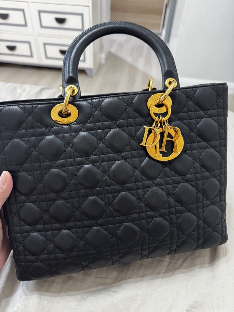 Dior Lady Dior Black Leather Handbag (Category: Luxury Bags & Wallets) located in Quezon City. Submitted by pinkpracticalmom (Listing ID 1432628806, Image 2). Description: - Authentic Lady Dior handbag -Size Large - vintage - Gold-tone 24K platedhardware - Includes shoulder strap, complete Dior charms and Entrupy cert - Bought this for 155k, selling low RFS: Decluttering Negotiable.