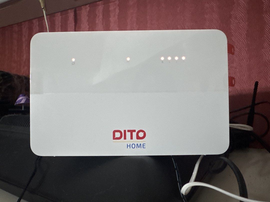 DITO Home Router (Category: Networking) located in Manila. Submitted by mysticshark.044777 (Listing ID 1432753449, Image 1). Description: - DITO Home Router - White color with DITO Home logo - Features indicator lights - Includes router and power cable - Ideal for home internet use.