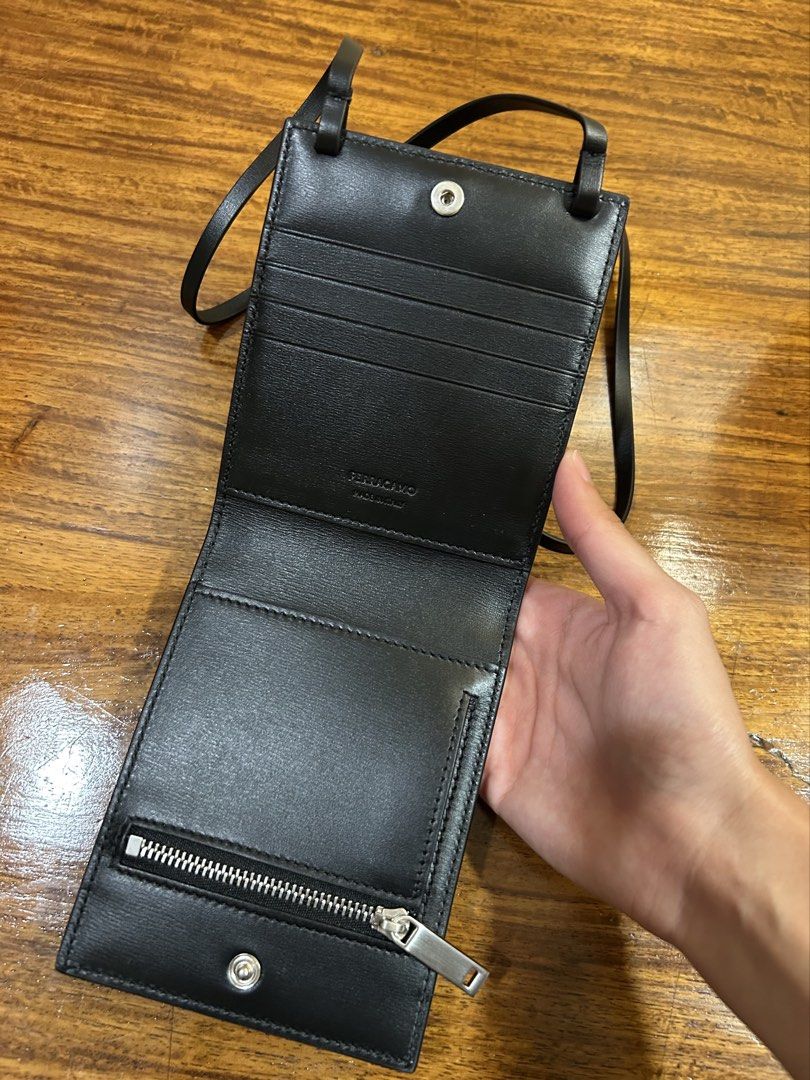 Ferragamo Calf Leather Card Holder (Category: Luxury Bags & Wallets) located in Paranaque City. Submitted by daftspect (Listing ID 1432736731, Image 3). Description: Ferragamo Black Calfskin Cardholder with Sling • RFS: Funds, not my style • Condition: Brand new in packaging, besides to take pictures • Can request further pictures • Price negotiable MOD: Meet-up, Lalamove MOP: GCash, bank transfer .