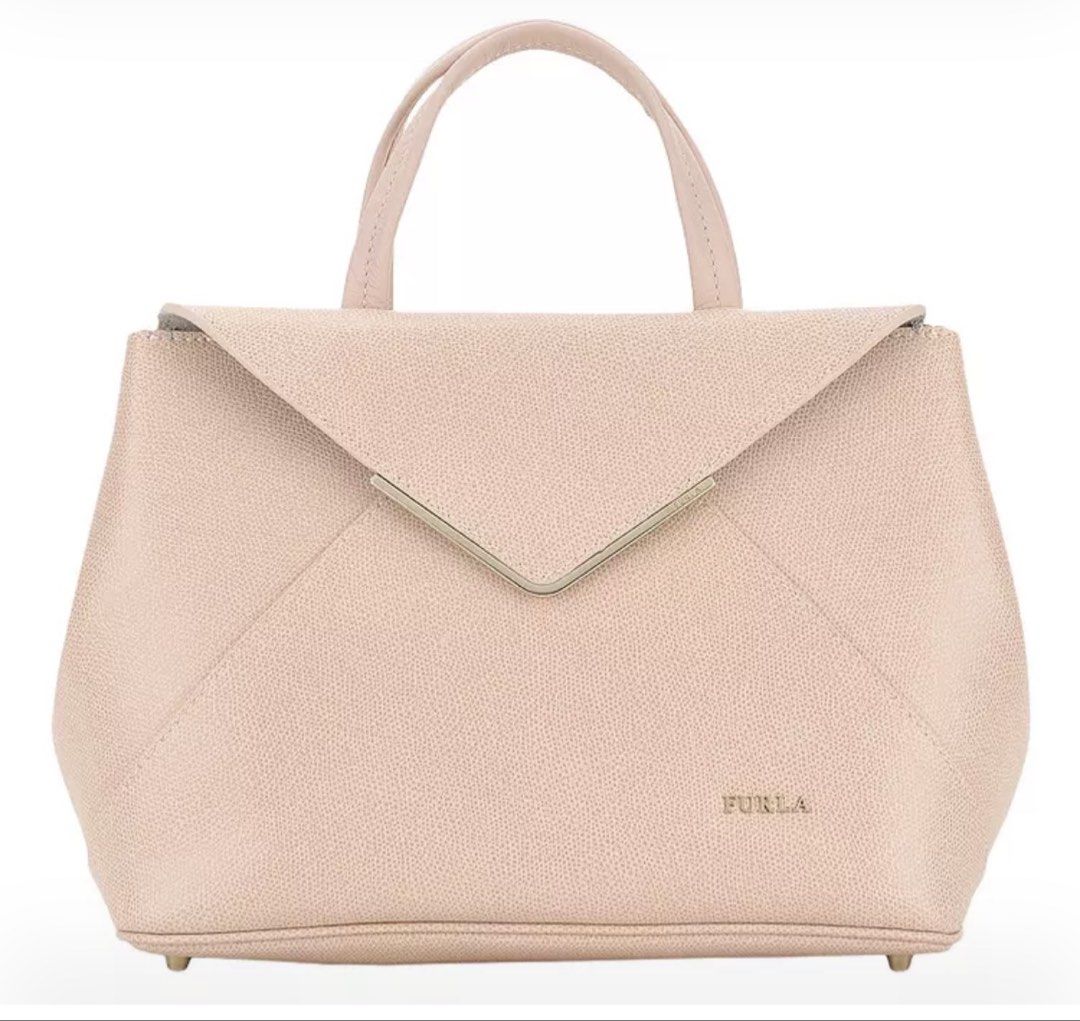 Furla envelope bag (Category: Luxury Bags & Wallets) located in Bulacan. Submitted by msdavid (Listing ID 1432654858, Image 1). Description: Bought in ragtag osaka Still includes receipt Last price posted Can be body bag Small flaw in the third pic but barely noticeable cause its almost on the inside.