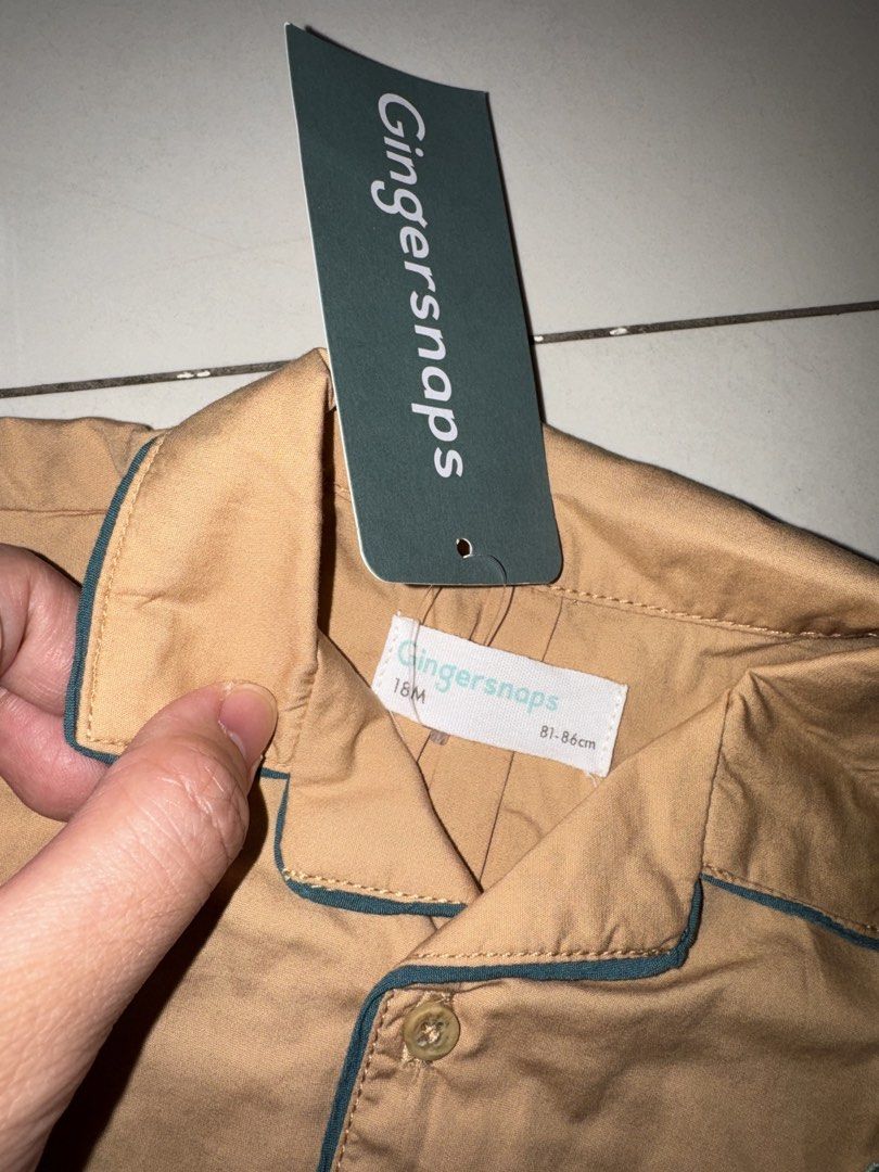 Gingersnaps Embroidered Shirt 18M (Category: Babies & Kids Fashion) located in Manila. Submitted by declutter_with_mrs (Listing ID 1432749539, Image 2). Description: - Gingersnaps short-sleeved shirt - Color: Tan - Design: Embroidered octopus and crab - Pocket with green trim - Green trim on collar and sleeves - Button-down closure - Size: 18M RFS: decluttering MOP: gcash MOD: grab/lalamove PICKUP LOC: BGC, Taguig SF shoulder by buyer STRICTLY PA