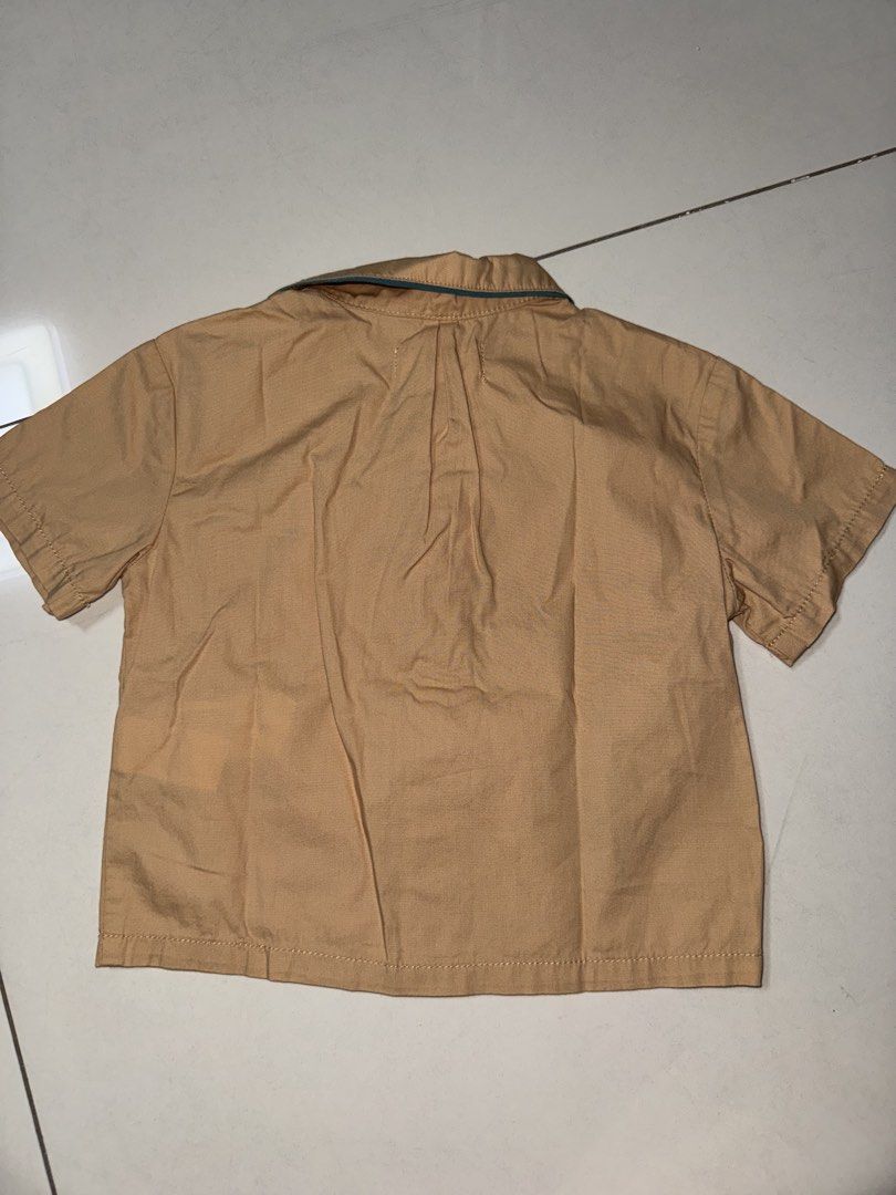 Gingersnaps Embroidered Shirt 18M (Category: Babies & Kids Fashion) located in Manila. Submitted by declutter_with_mrs (Listing ID 1432749539, Image 3). Description: - Gingersnaps short-sleeved shirt - Color: Tan - Design: Embroidered octopus and crab - Pocket with green trim - Green trim on collar and sleeves - Button-down closure - Size: 18M RFS: decluttering MOP: gcash MOD: grab/lalamove PICKUP LOC: BGC, Taguig SF shoulder by buyer STRICTLY PA