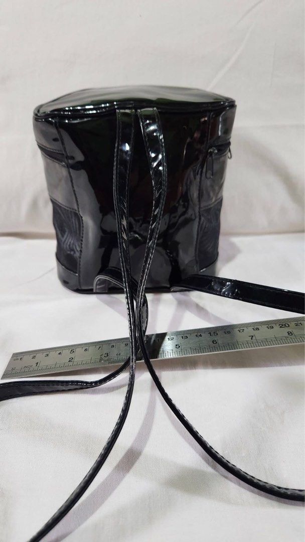 Givenchy Vanity Bag Cosmetic Box Backpack (Category: Luxury Bags & Wallets) located in Angeles City. Submitted by noagrace (Listing ID 1432629281, Image 2). Description: - Authentic Givenchy vanity bag - Black patent leather exterior - Mesh panel detail - Top zipper closure - Givenchy logo on front - Ideal as a cosmetic box daypack.