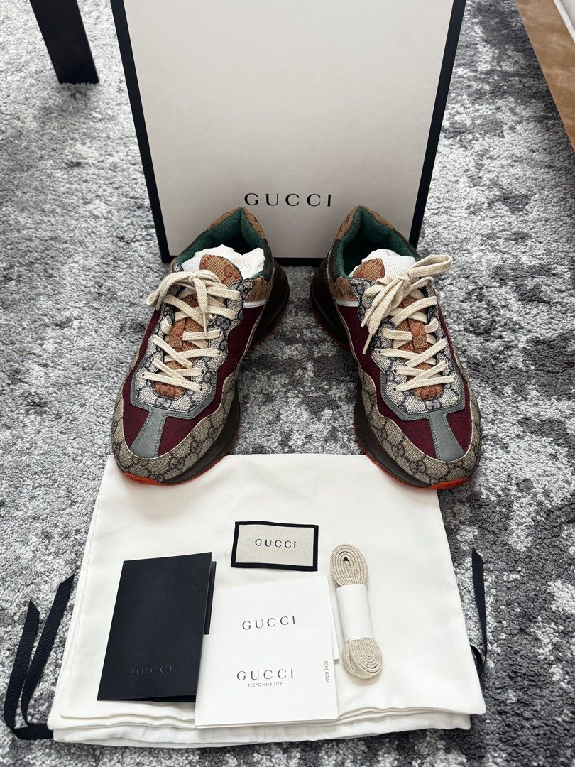 Gucci Ultrapace Sneakers (Category: Sneakers & Footwear) located in Hermosa. Submitted by sabzai (Listing ID 1432611839, Image 1). Description: - Authentic Gucci Ultrapace sneakers - Features the iconic Gucci monogram pattern - Color combination: Brown, burgundy, and green - Sole color: Brown with orange accent - Condition: Worn once - Includes: Original box, dust bag, extra laces, and receipt It’s my husband’s shoes, apparently he really preferr