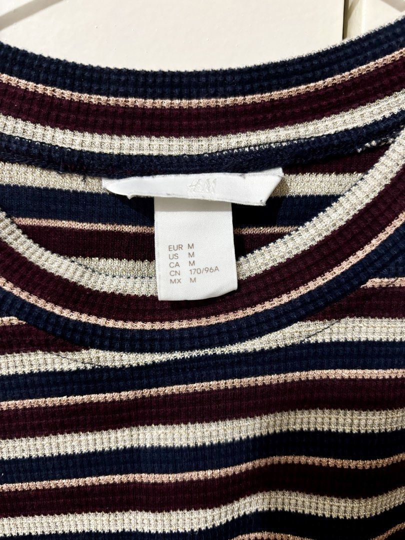 H&M Striped Ribbed T-shirt - Size M (Category: Shirts) located in Marikina City. Submitted by mattysgn (Listing ID 1432645869, Image 2). Description: - H&M Ribbed T-Shirt - Size: M - Color: Navy, Burgundy, White stripes - Features: Round neckline, short sleeves - Condition: Good.
