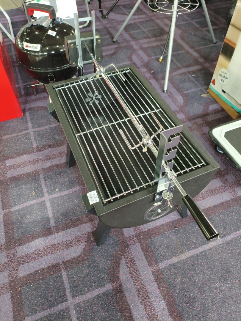 HMR Small Charcoal Spit Roa (Category: Other Kitchenware & Tableware) located in Manila. Submitted by hmrgrace5. (Listing ID 1432615863, Image 3). Description: - Brand new charcoal grill - Features a rotisserie function - Rectangular grilling surface - Sturdy metal frame and legs - Includes spit rod and motor for rotating food - Price: PHP 3,999.00.