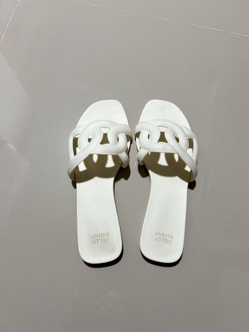 Jelly Bunny Grase Glis Flat Sandals - White (Category: Flats & Sandals) located in Bulacan. Submitted by clncon (Listing ID 1432624231, Image 3). Description: - White-colored Jelly Bunny flat sandals - Unique chain-link strap design - Made of a rubbery material - Features the Jelly Bunny logo - Original price: ₱1,481.10 (bought in BKK) - 24.5 cm ‼️ 1,500 pesos for both sandals.