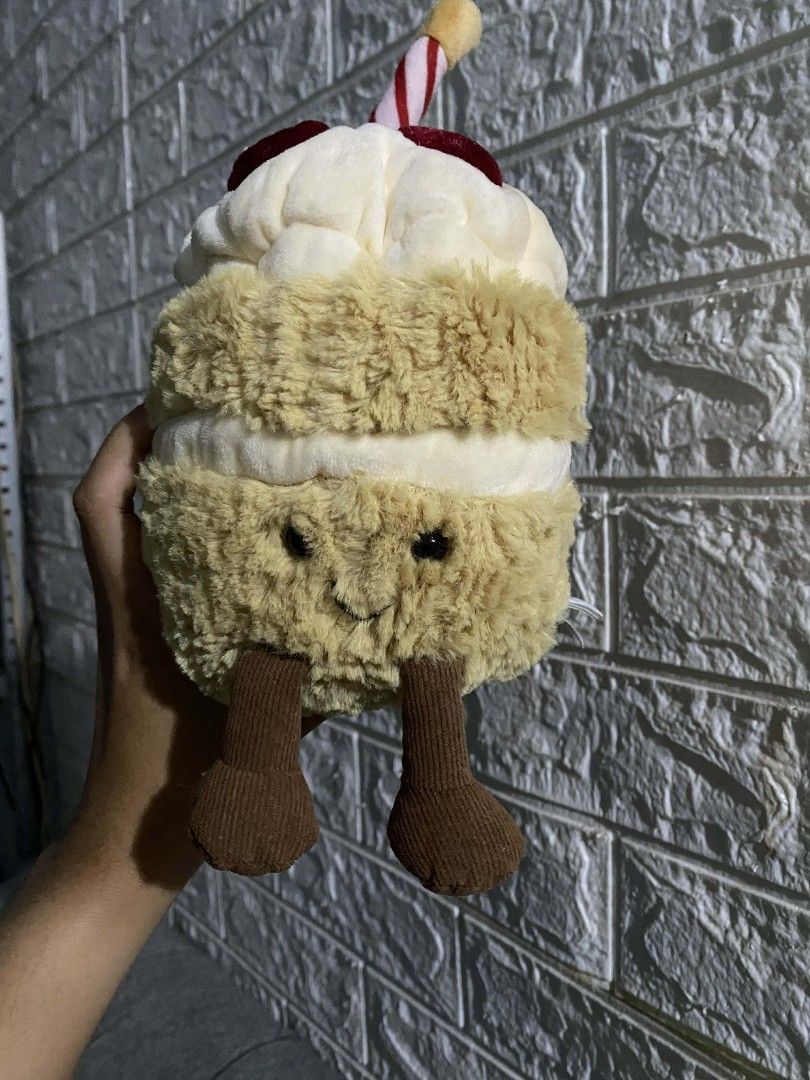 Jellycat Amuseable Birthday Cake Plush (Category: Plushies & Soft Toys) located in Manila. Submitted by jb_alvarez1 (Listing ID 1432750238, Image 1). Description: - Jellycat Amuseable Birthday Cake plush - Soft and fluffy design - Features a candle and cherry details - Cute face and small legs - Made of soft, plush material - Great for cuddling or decoration.