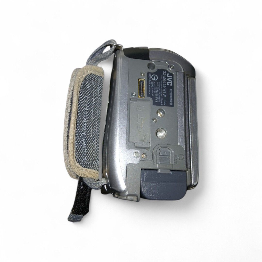 Vintage JVC Everio Camera/Recorder with Accessories (Category: Video Cameras) located in Manila. Submitted by whoskylie (Listing ID 1432729108, Image 3). Description: The JVC Everio GZ-MG155 is a digital camcorder designed for hobbyists, featuring a 30 GB built-in hard drive for ample storage. It offers 32x optical and 800x digital zoom for capturing distant subjects, a 2.7-inch widescreen LCD for easy framing, a 1MP CCD sensor for clear images, 
