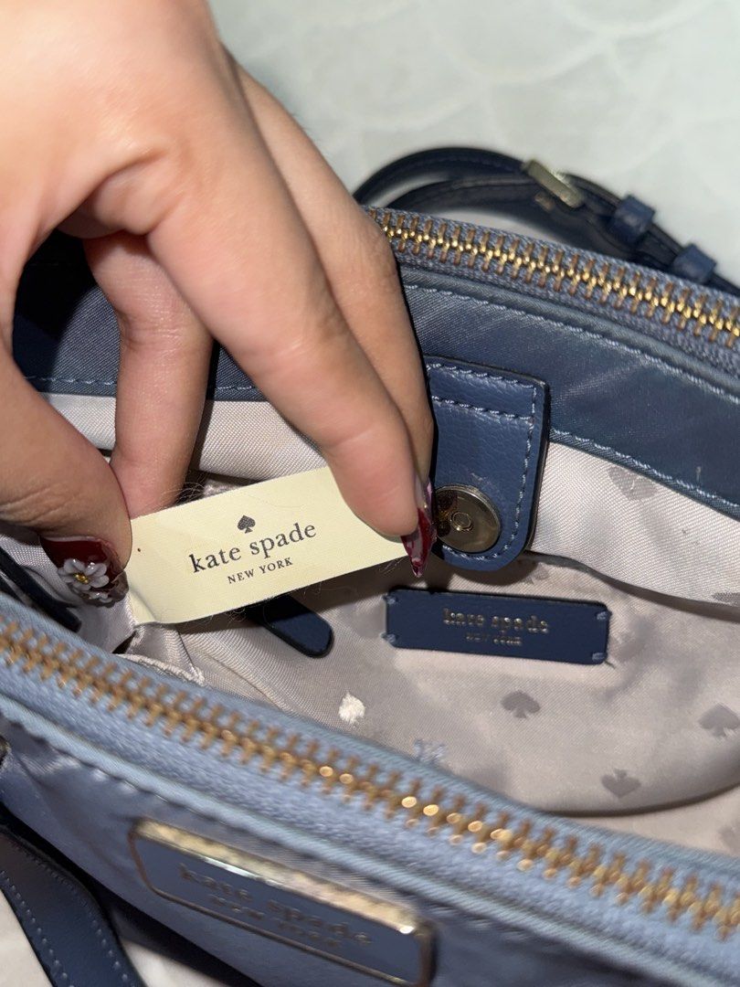Kate Spade New York Handbag (Category: Luxury Bags & Wallets) located in Quezon City. Submitted by prelovedbyvielle (Listing ID 1432756061, Image 3). Description: - 💯 AUTHENTIC KATE SPADE BOUGHT DIRECTLY FROM USA - Blue Crossbody Bag - Nylon Texture - Has Flaws; Please See Images Posted - No Box, No Receipts, No Dust Bag.