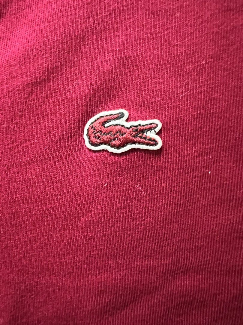 Lacoste V-Neck T-Shirt - Size 40 (Category: Shirts) located in Meycauayan. Submitted by 3fold (Listing ID 1432696412, Image 1). Description: - Authentic Lacoste V-neck T-shirt - maroon color in actual - Iconic Lacoste crocodile logo on the chest - Made in Peru - Size 40 - Style code: TF7880 - From Lacoste Operations, Paris (France).