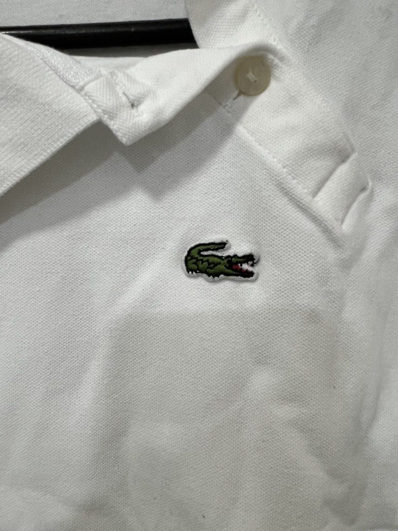 Lacoste White Polo Shirt (Category: Others Tops) located in Meycauayan. Submitted by 3fold (Listing ID 1432698598, Image 2). Description: White Destructured Collar And Kimono Sleeves Stretch Mini Pique Regular Fit Polo T-Shirt Dimes:L 22 W 22-18tapered.