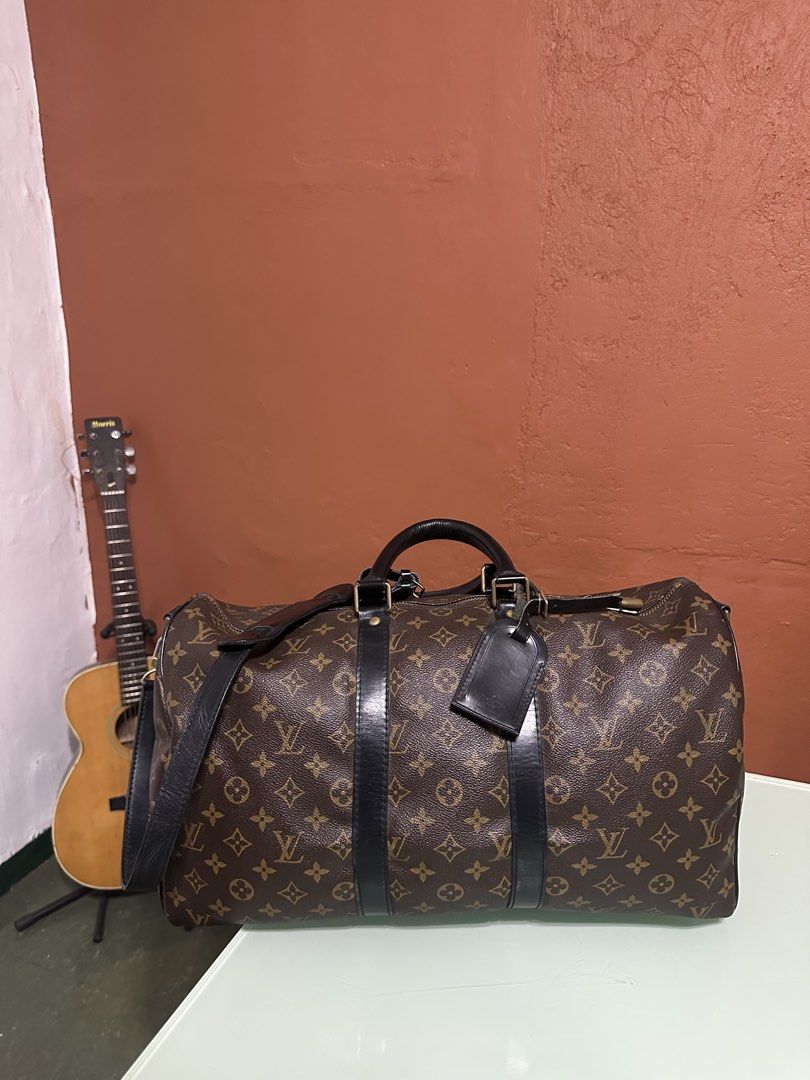 Louis Vuitton Keepall Bandouliere 45 (Category: Luxury Bags & Wallets) located in Batangas. Submitted by jim2621 (Listing ID 1432637036, Image 2). Description: - Authentic Louis Vuitton Keepall Bandouliere 45 - Iconic Monogram canvas. - Black leather trim and handles. - Detachable shoulder strap included. - Comes with a luggage tag. - Spacious interior for travel. - Secure zipper closure. - Classic and timeless design. Including luggage tag not i