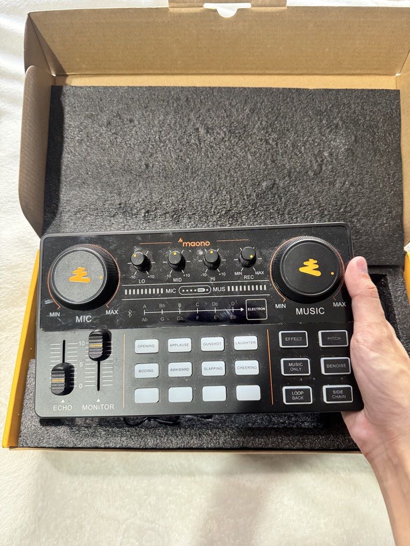 MaonoCaster Lite AU-AM200 Podcast Console (Category: TV Consoles) located in Quezon City. Submitted by chrollo7 (Listing ID 1432664559, Image 3). Description: - Portable podcast console for professional audio - Supports 2-person live streaming and up to 4 platforms - Dual microphone input - Independent volume control for mics and accompaniment - Bluetooth 5.0 wireless connection - Up to 8 hours of battery life - Bought for 4k.