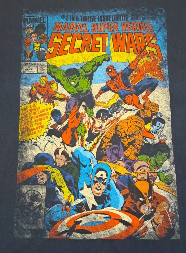 Marvel Super Heroes Secret Wars Vol. 1 #1 (Category: Tshirts & Polo Shirts ) located in Naga. Submitted by shindoce (Listing ID 1432608364, Image 2). Description: Marvel Comic Cover, Mad Engine Tag Art by: Michael Zeck and John Beatty Cover Date: May, 1984 Washed and steamed condition Size: L 21.5x29, graphic fading PHP 1200 + SF.