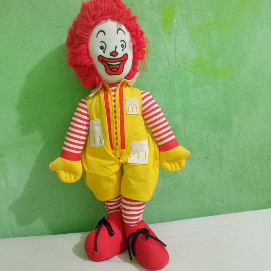 McDonald's Ronald McDonald Plush Doll (Category: Plushies & Soft Toys) located in Manila. Submitted by feg39 (Listing ID 1432686954, Image 2). Description: - Vintage Ronald McDonald plush doll - Large doll features: - Red wig - Yellow jumpsuit with McDonald's logo - Red and white striped sleeves and legs - Smiling face - Red shoes - Includes a smaller Ronald McDonald doll holding a soccer ball - Tag with Japanese text *** 16inch Grimace 2002 is a