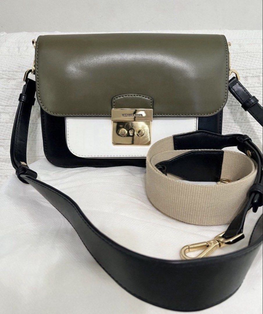 Michael Kors Sloan Editor Leather Tri-color (Category: Luxury Bags & Wallets) located in Quezon City. Submitted by whengaloolu (Listing ID 1432686456, Image 1). Description: - Michael Kors shoulder bag - Color block design: olive green, white, black - Gold-tone clasp closure - Includes two straps: - Black leather strap - Beige fabric strap - White interior - Zippered pocket - Ideal for everyday use.