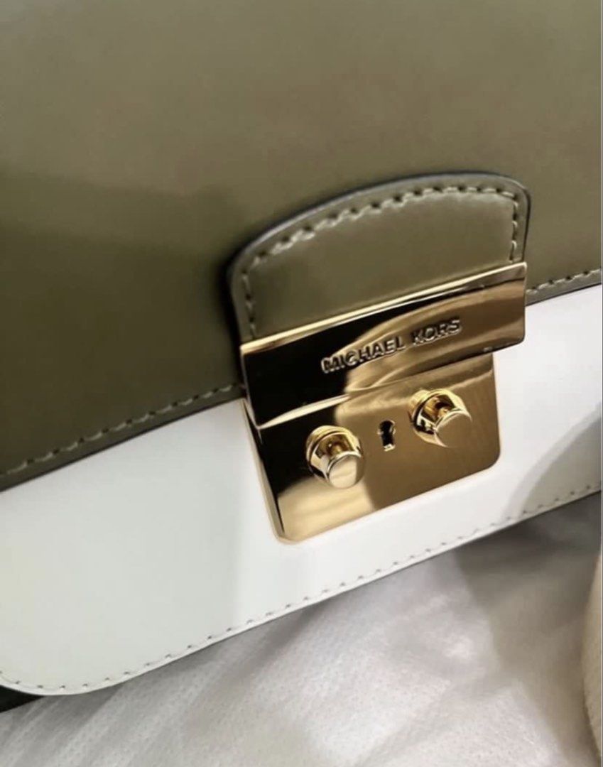 Michael Kors Sloan Editor Leather Tri-color (Category: Luxury Bags & Wallets) located in Quezon City. Submitted by whengaloolu (Listing ID 1432686456, Image 2). Description: - Michael Kors shoulder bag - Color block design: olive green, white, black - Gold-tone clasp closure - Includes two straps: - Black leather strap - Beige fabric strap - White interior - Zippered pocket - Ideal for everyday use.