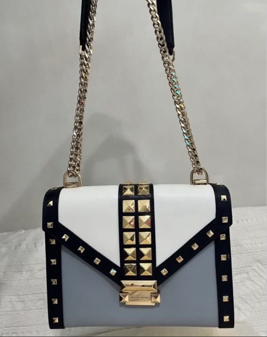 Michael Kors Whitney Studded Shoulder Bag (Category: Luxury Bags & Wallets) located in Quezon City. Submitted by whengaloolu (Listing ID 1432687198, Image 2). Description: - Michael Kors shoulder bag - Tri-color design: white, gray, and navy - Gold chain strap - Gold-tone hardware with studded accents - Logo clasp - Interior zippered pocket - Flap closure - Structured silhouette.