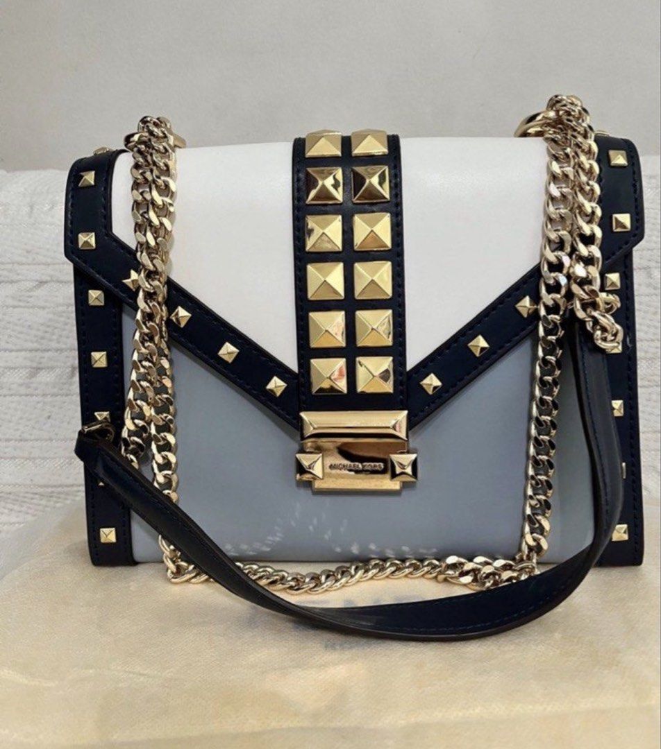Michael Kors Whitney Studded Shoulder Bag (Category: Luxury Bags & Wallets) located in Quezon City. Submitted by whengaloolu (Listing ID 1432687198, Image 1). Description: - Michael Kors shoulder bag - Tri-color design: white, gray, and navy - Gold chain strap - Gold-tone hardware with studded accents - Logo clasp - Interior zippered pocket - Flap closure - Structured silhouette.