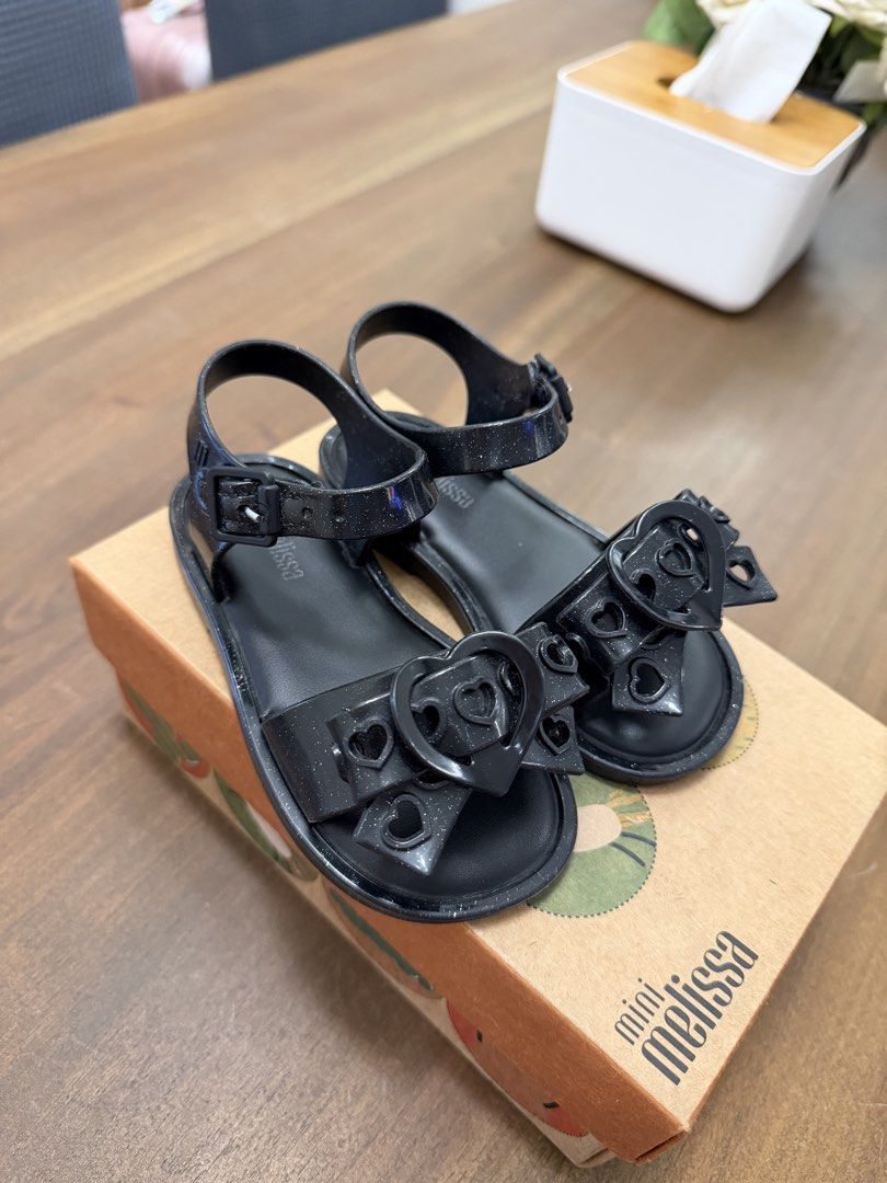 Mini Melissa Mar Sandal Hot BB Glitter Black (Category: Babies & Kids Fashion) located in Valenzuela. Submitted by janellepynr (Listing ID 1432638567, Image 2). Description: - Mini Melissa Mar Sandal - Color: Black - Size: USA 8 - Design: Heart-shaped - Model: 33951 - Features glitter - Made in Brazil.