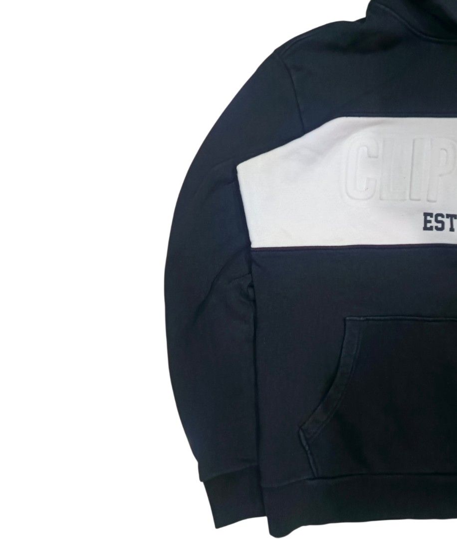 NBA LA Clippers Hoodie (Category: Hoodies) located in General Santos City (Dadiangas). Submitted by _jackeith (Listing ID 1432701569, Image 2). Description: - Black Clippers hoodie, size L. - Features "CLIPPERS EST.1984" on the front. - "WESTERN CONF. LA CLIPPERS" on the back. - White stripe across chest and back. - Includes a hood and front pocket. - Condition: No Issue - Dimes: 27L x 23W.