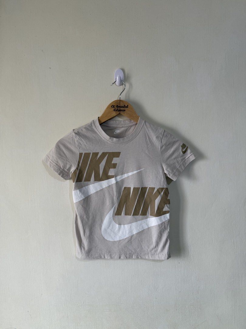 Nike shirt (Category: Babies & Kids Fashion) located in Angeles City. Submitted by buyforless04 (Listing ID 1432725374, Image 1). Description: 6-7.